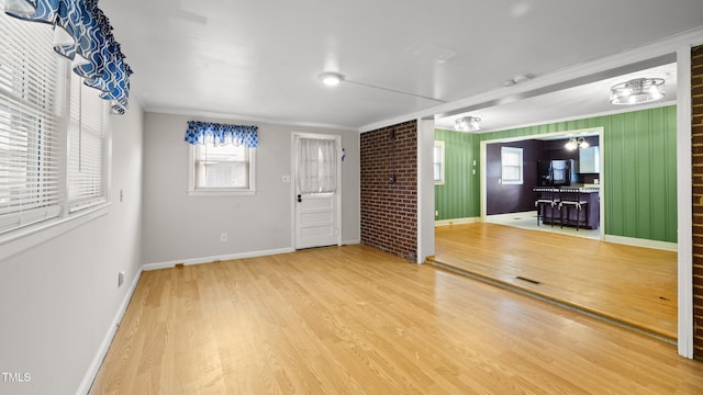 interior space featuring hardwood / wood-style flooring and crown molding