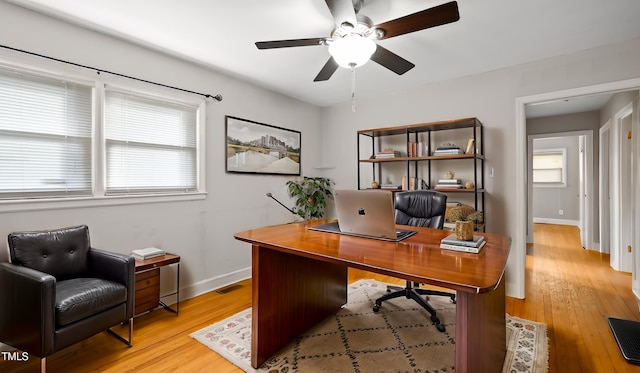 office with hardwood / wood-style flooring, plenty of natural light, and ceiling fan