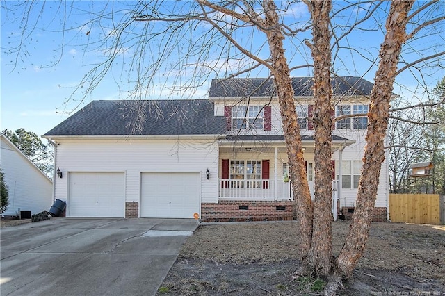 view of front of property with a porch and a garage