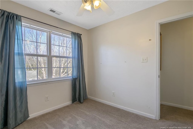 carpeted empty room with ceiling fan