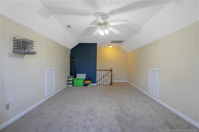 bonus room featuring vaulted ceiling, carpet flooring, and ceiling fan