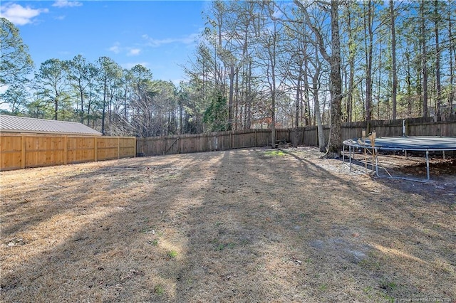 view of yard featuring a trampoline