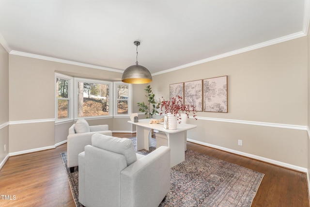 dining space with ornamental molding and dark hardwood / wood-style flooring