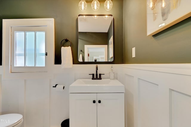 bathroom featuring vanity and toilet