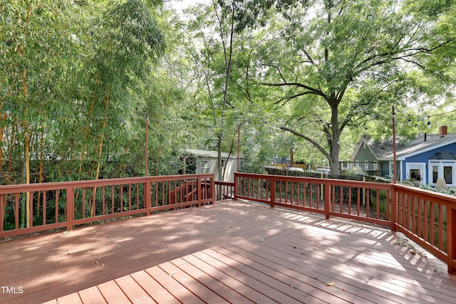 wooden terrace with a shed