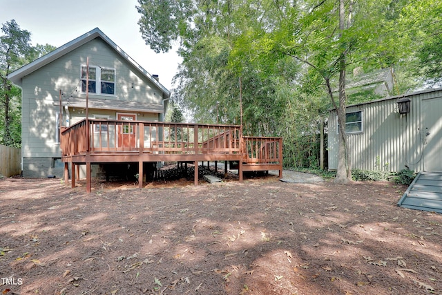 back of property with a deck