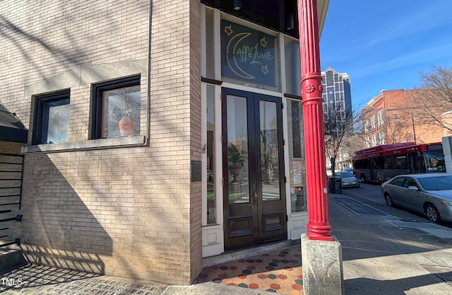 view of exterior entry featuring french doors