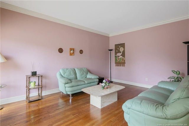 living room featuring hardwood / wood-style floors and crown molding