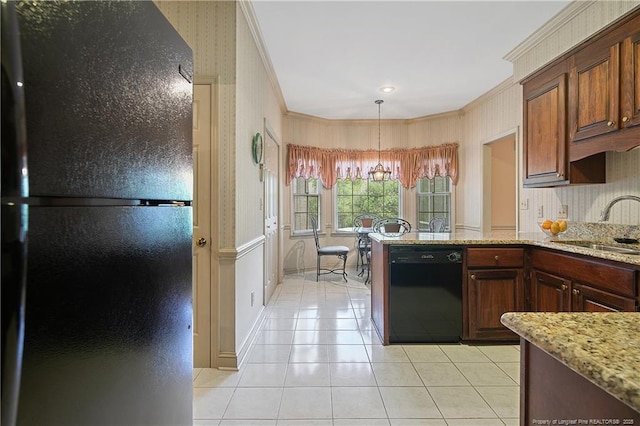 kitchen featuring sink, light tile patterned floors, ornamental molding, black appliances, and light stone countertops