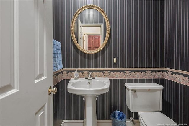 bathroom featuring sink and toilet