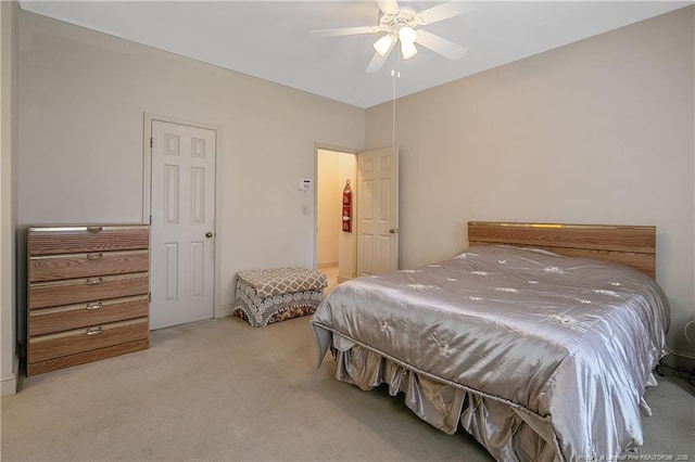 bedroom featuring light colored carpet and ceiling fan