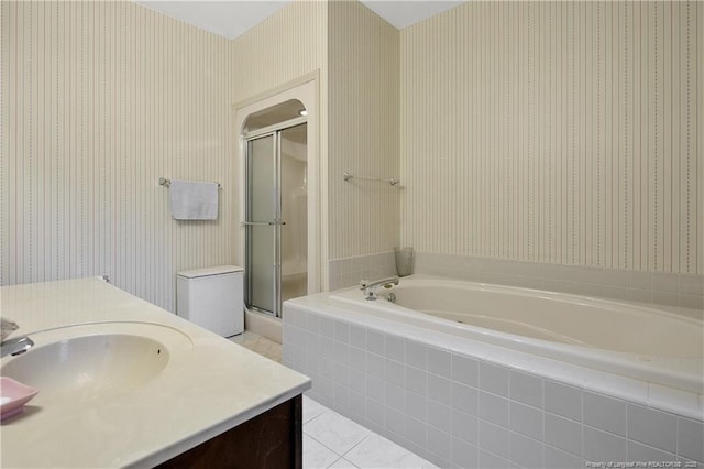 bathroom with tile patterned floors, vanity, and plus walk in shower