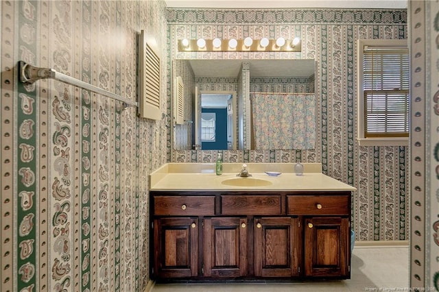 bathroom featuring tile patterned flooring and vanity