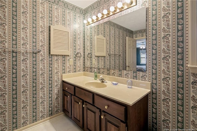 bathroom with vanity and tile patterned flooring