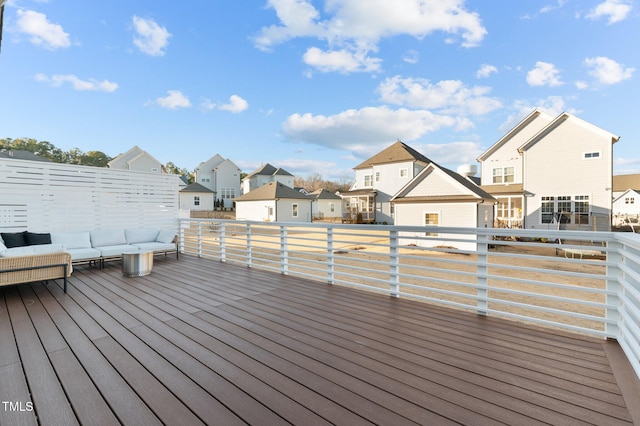 wooden terrace featuring an outdoor hangout area