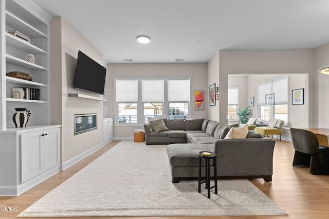 living room with light hardwood / wood-style floors