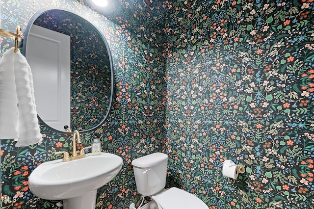 bathroom with sink and toilet