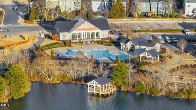 birds eye view of property with a water view