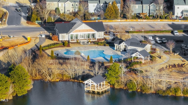 birds eye view of property featuring a water view