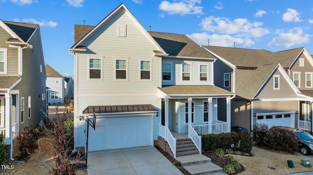 view of front of house with a garage and a porch