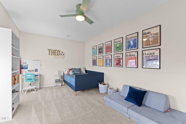 bedroom featuring ceiling fan and light carpet