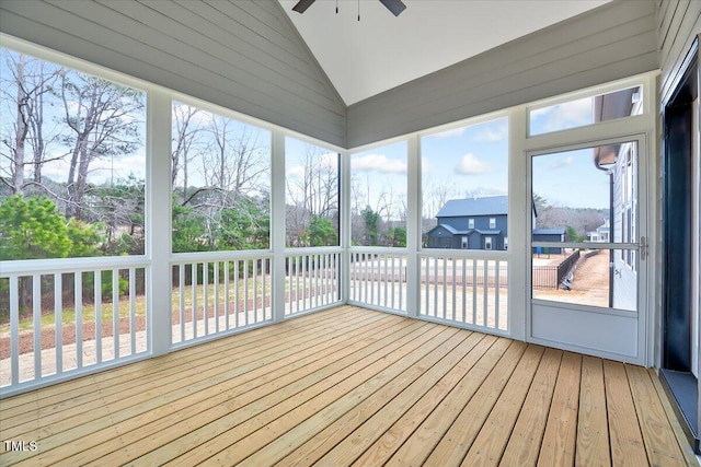 unfurnished sunroom featuring vaulted ceiling and ceiling fan