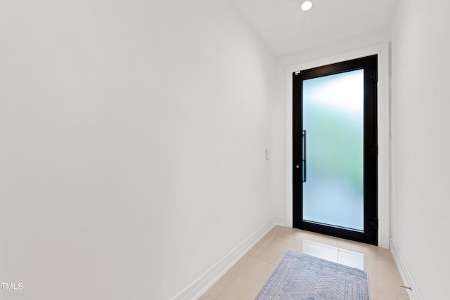 doorway featuring light tile patterned floors