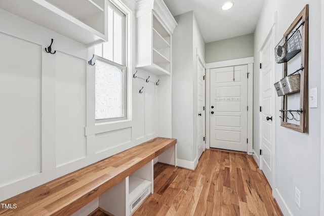 mudroom with a healthy amount of sunlight and light hardwood / wood-style flooring