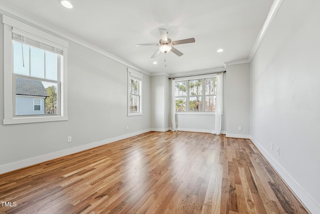 empty room with crown molding, light hardwood / wood-style floors, and ceiling fan