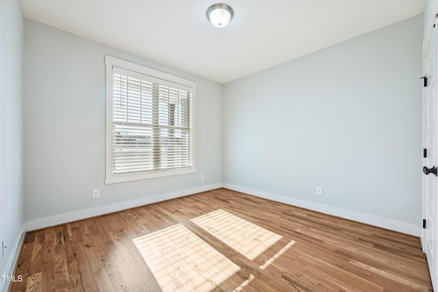 empty room featuring hardwood / wood-style flooring