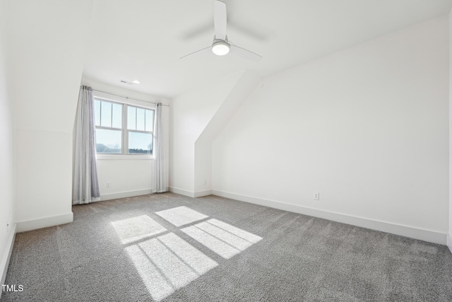 bonus room featuring carpet flooring and ceiling fan