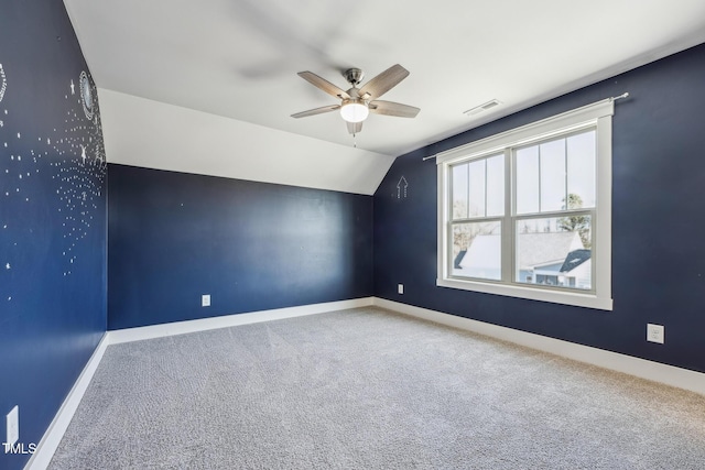 additional living space with lofted ceiling, carpet floors, and ceiling fan