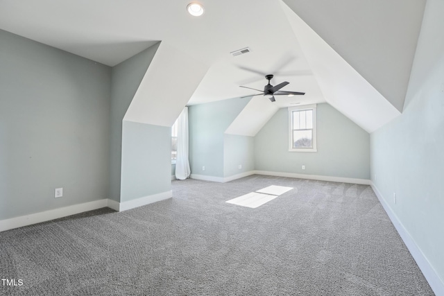 additional living space featuring lofted ceiling, light colored carpet, and ceiling fan