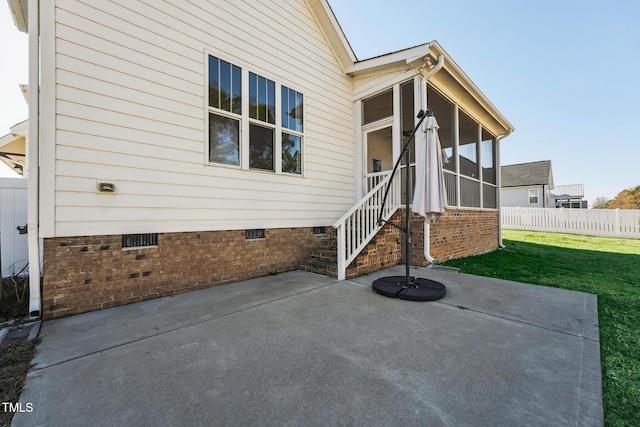 view of patio / terrace with a sunroom