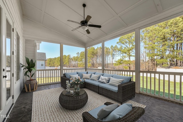 sunroom / solarium with ceiling fan and lofted ceiling