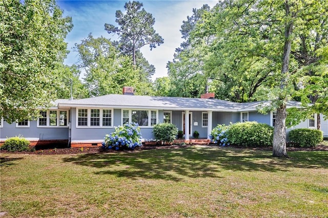 ranch-style home featuring a front yard