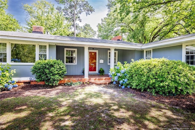 509 Vista Dr, Fayetteville, NC 28305 - view of front of house featuring a chimney and a porch