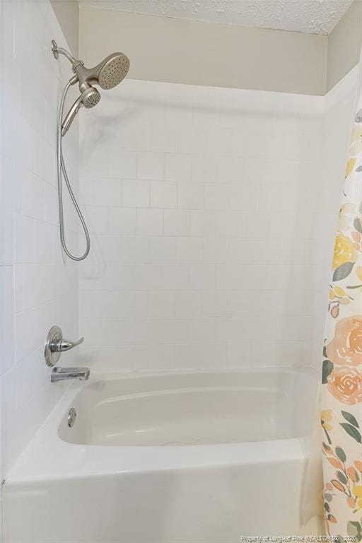 509 Vista Dr, Fayetteville, NC 28305 - full bathroom featuring shower / bath combo and a textured ceiling