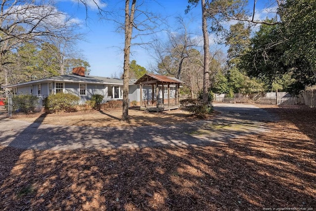 509 Vista Dr, Fayetteville, NC 28305 - back of house featuring a chimney and fence