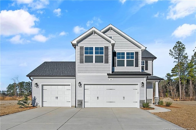 view of front of property featuring a garage, stone siding, roof with shingles, and driveway