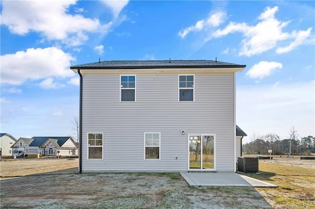 rear view of house with a patio area and central AC unit