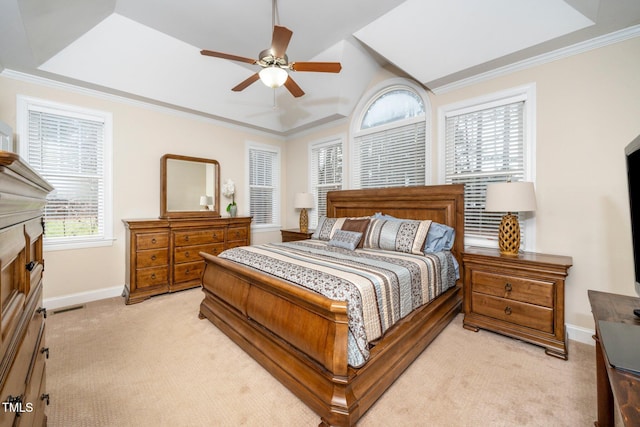 bedroom with crown molding, light colored carpet, and ceiling fan