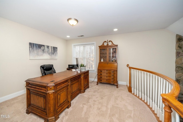 office featuring lofted ceiling and light carpet