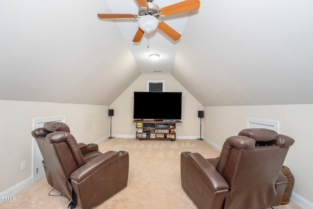 cinema featuring lofted ceiling, light colored carpet, and ceiling fan