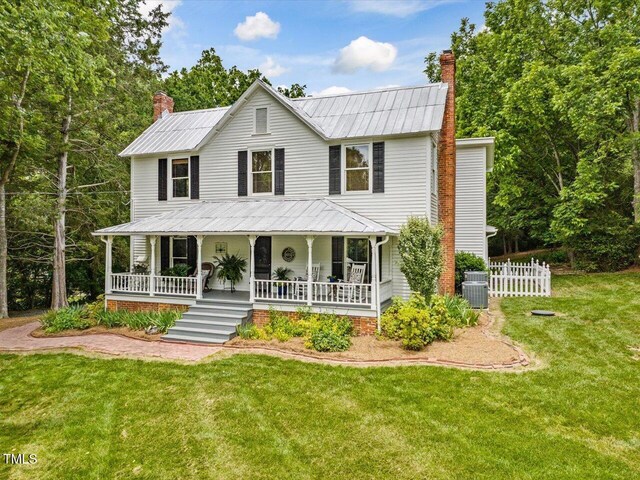 967 Bynum Rd, Pittsboro, NC 27312 - view of front of property with a chimney, covered porch, and metal roof