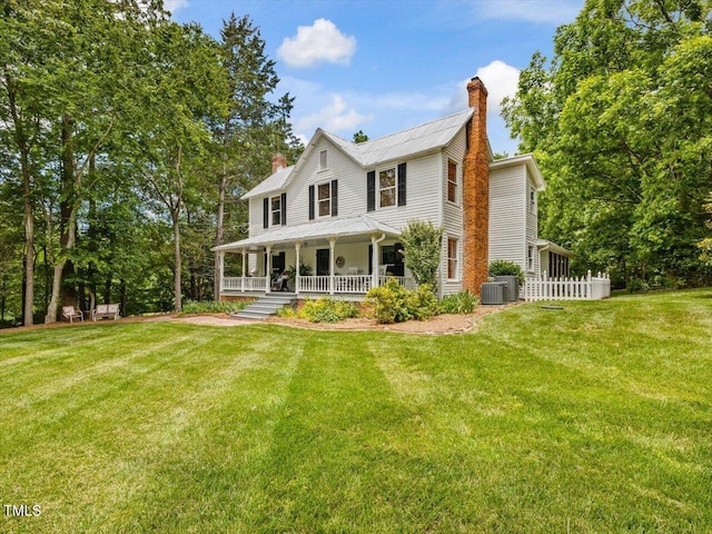 967 Bynum Rd, Pittsboro, NC 27312 - view of front of home featuring covered porch, a chimney, cooling unit, and a front lawn