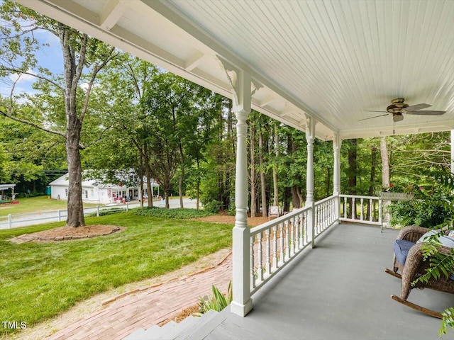 967 Bynum Rd, Pittsboro, NC 27312 - covered porch featuring ceiling fan, a yard, and view of scattered trees