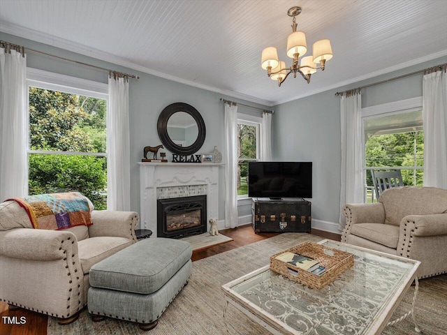967 Bynum Rd, Pittsboro, NC 27312 - living room featuring a chandelier, plenty of natural light, a fireplace with flush hearth, ornamental molding, and wood finished floors