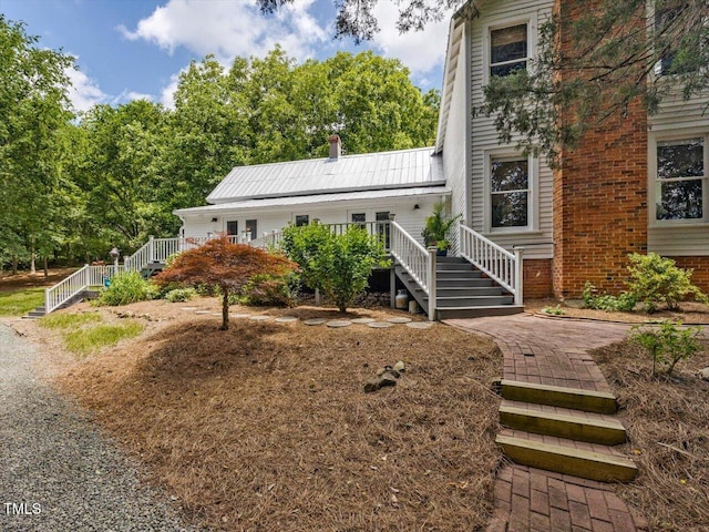 967 Bynum Rd, Pittsboro, NC 27312 - view of front facade with stairs and brick siding