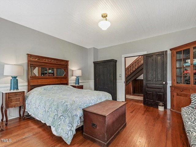967 Bynum Rd, Pittsboro, NC 27312 - bedroom with a wainscoted wall and wood-type flooring